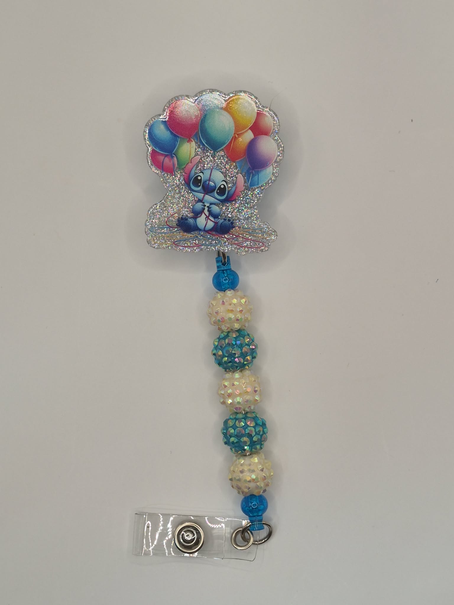 Blue alien with Balloons blue and white
